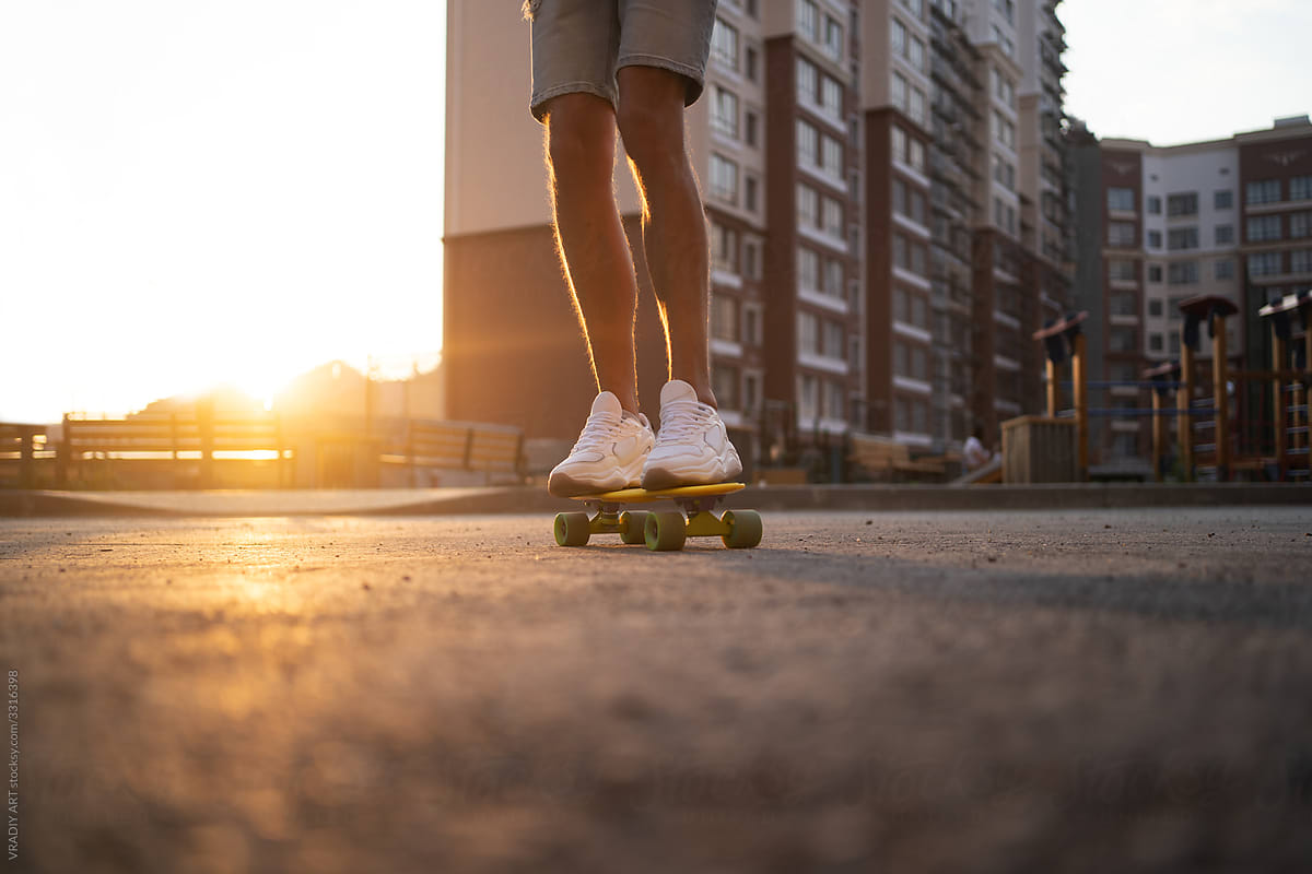 Urban activity: young man ridding on a skateboard