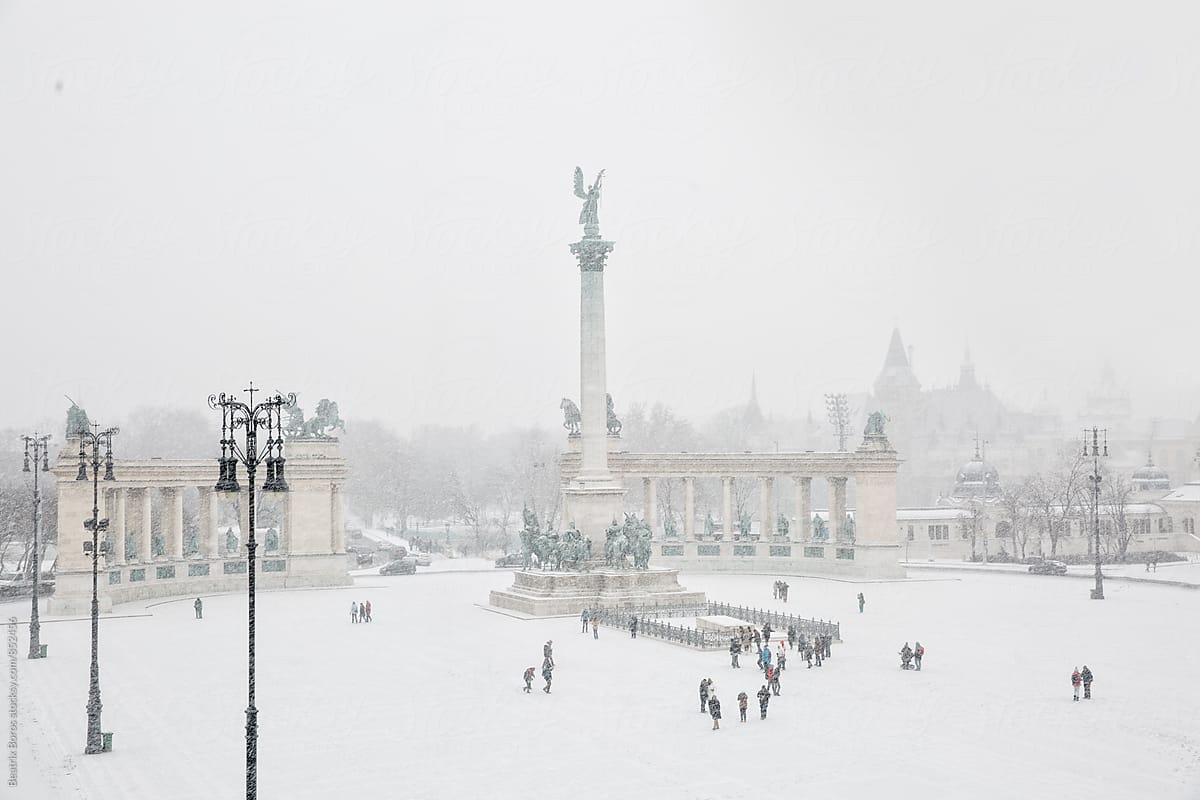 Heroes\' Square completely covered with snow in the Winter with unrecognisable people