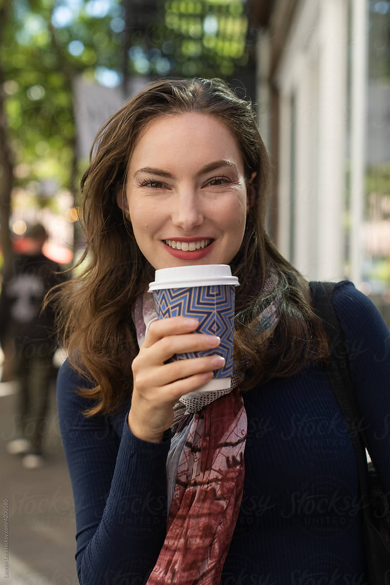 Woman on the go with coffee