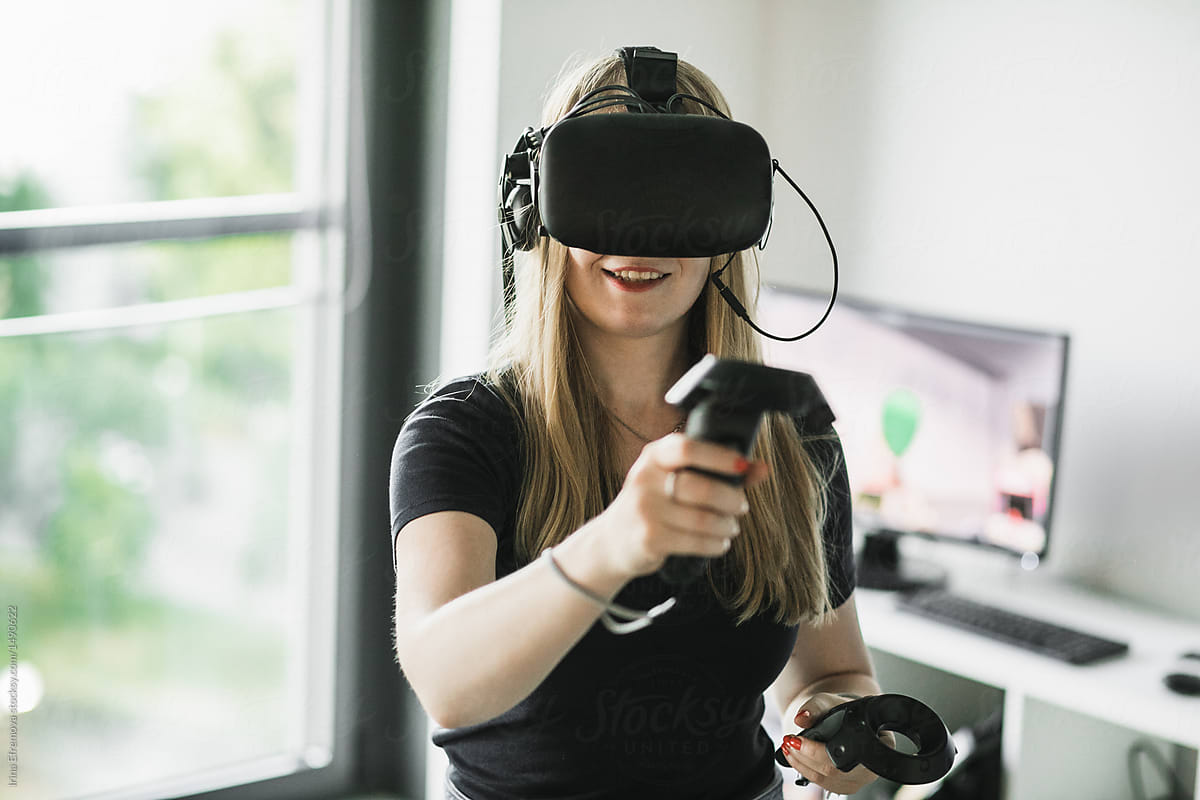 Blond girl playing VR game