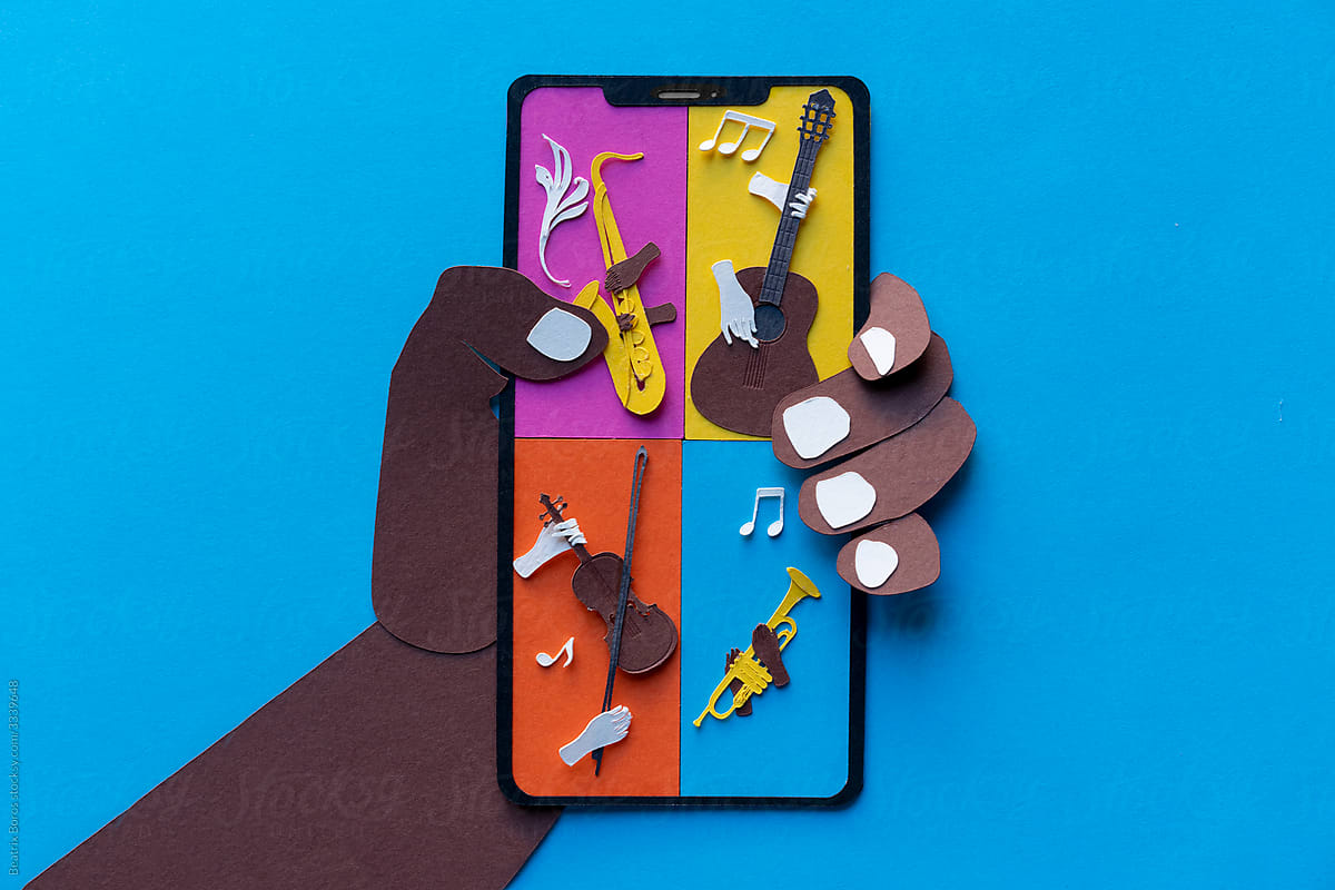 Black paper hand holding cellphone with musical instruments on display
