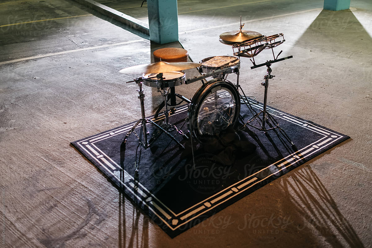 Drum kit set up in a parking garage