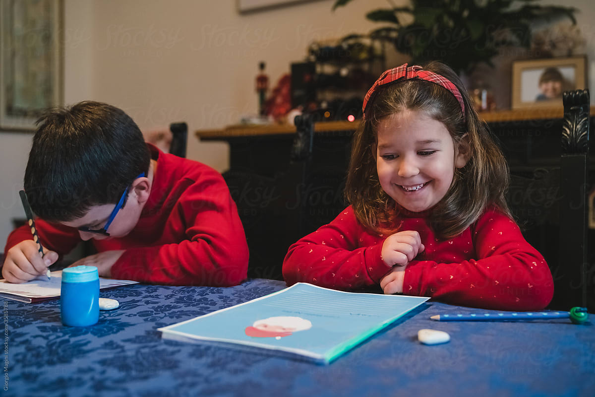 Siblings at Home Writing to Santa Claus