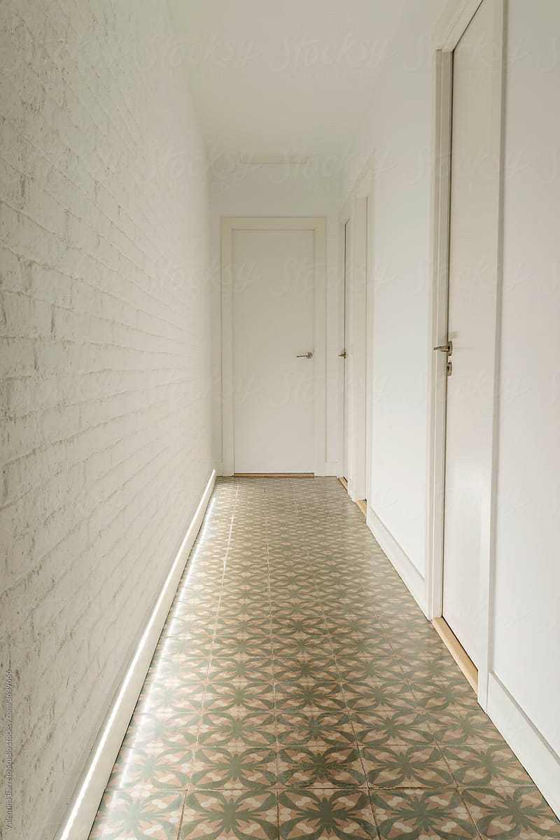 white brick wall and old tiles floor hall