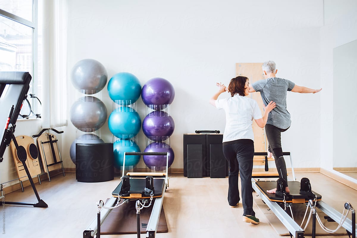 Woman Doing Fitness Exercise With Therapist