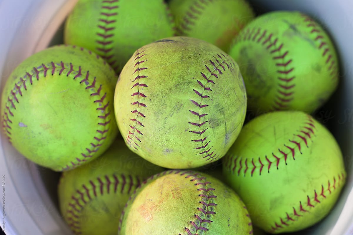Close up of a full bucket of softballs