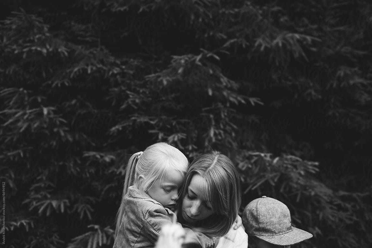 Black and white portrait of mother with kids.