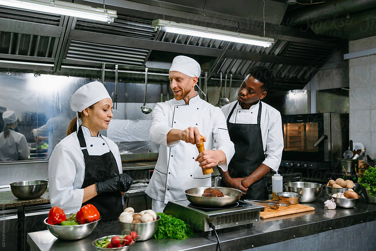 A team of chefs in a professional kitchen