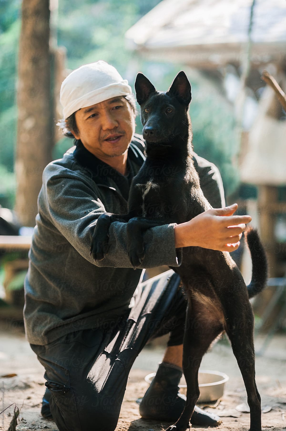 Asian man and his dog