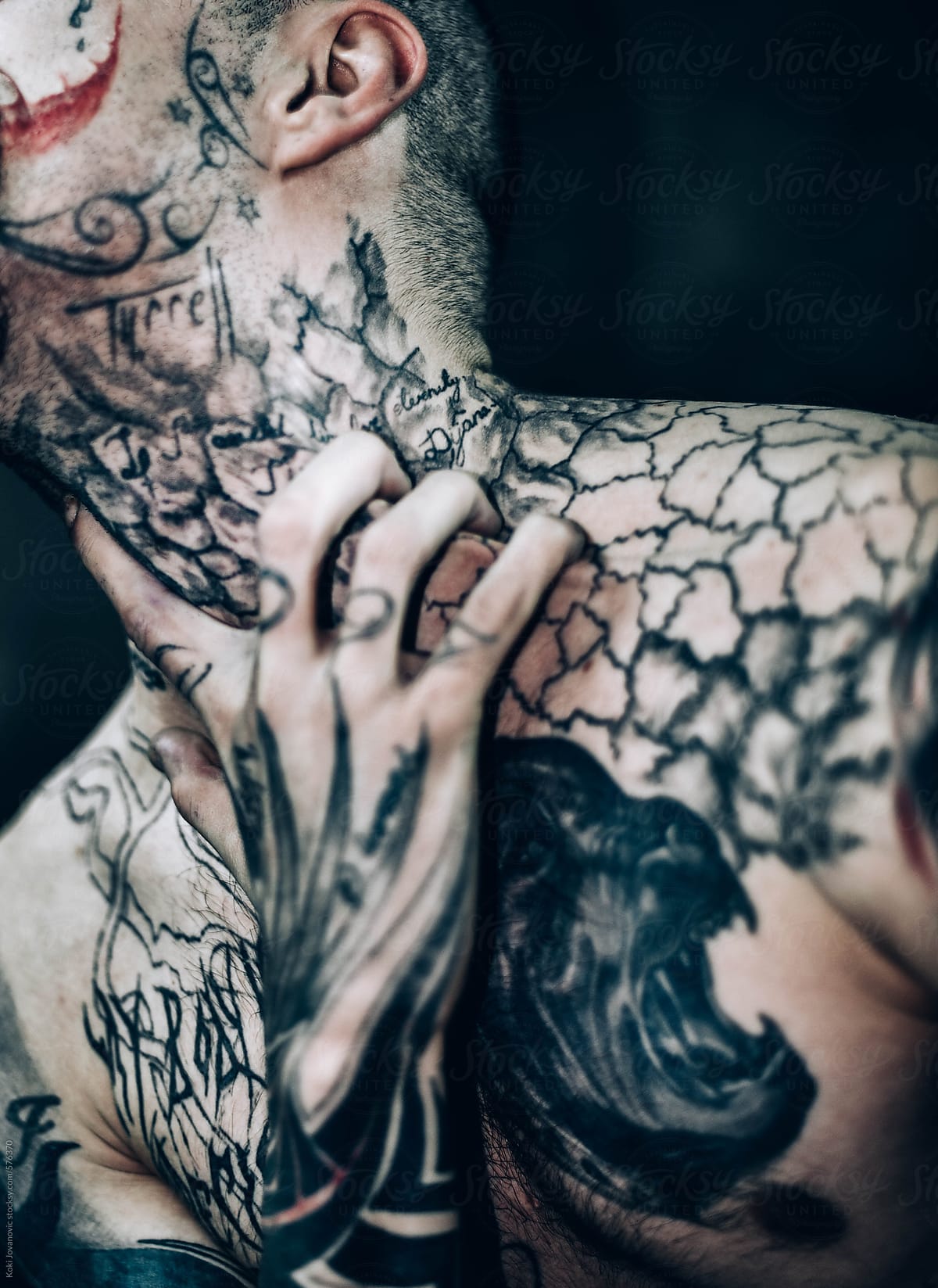 tattooed man posing
