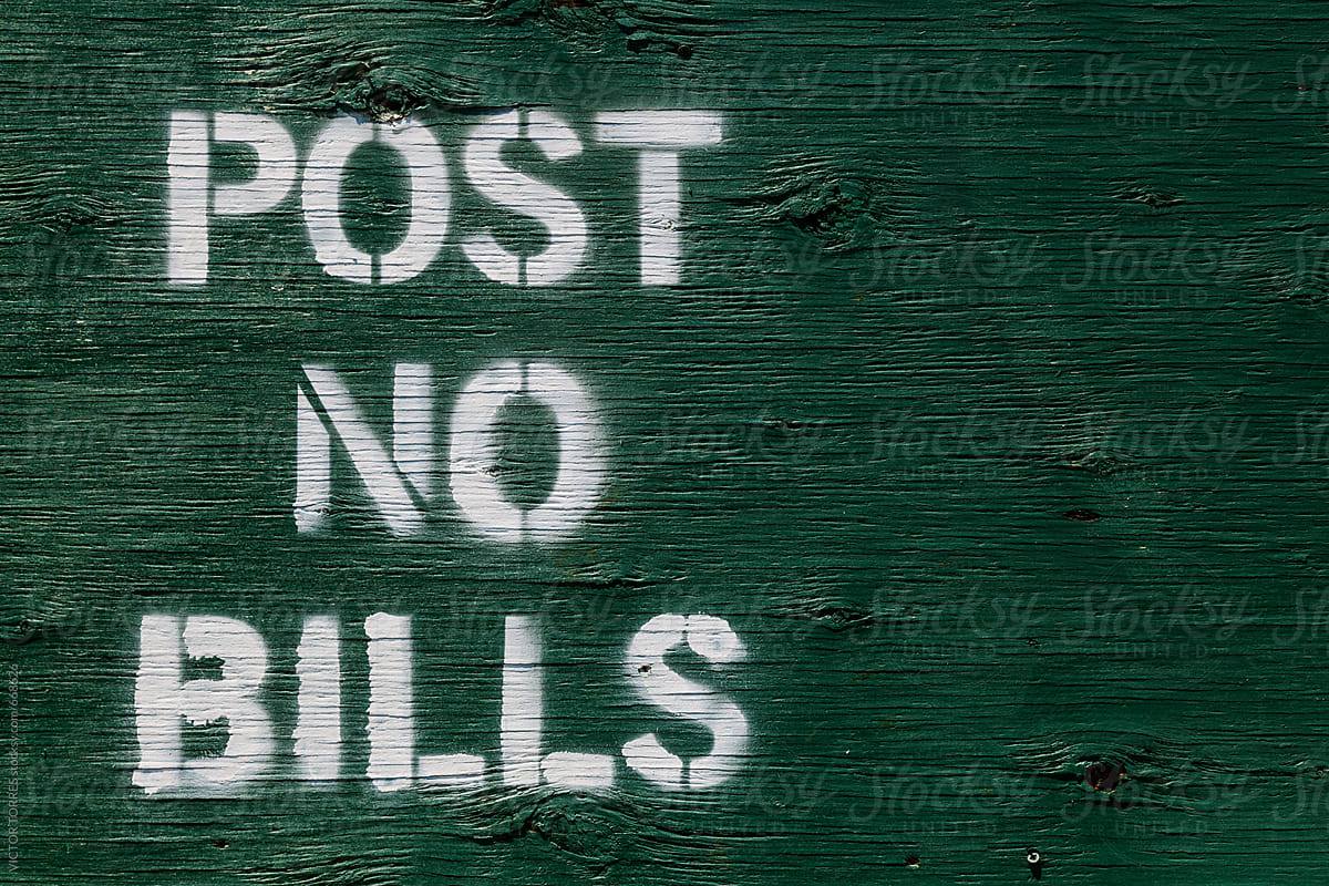 Post No Bills Message on a Green Wooden Wall