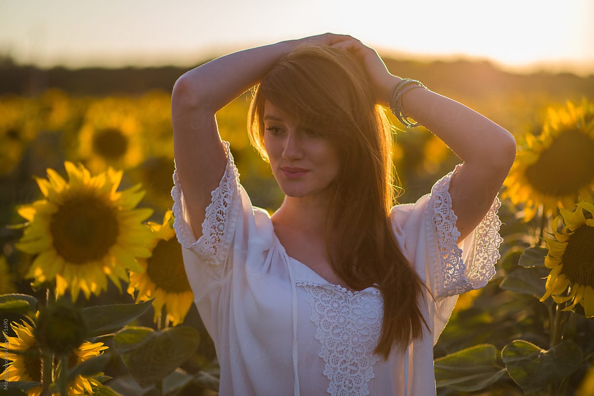 Woman Posing in Sunflower Field