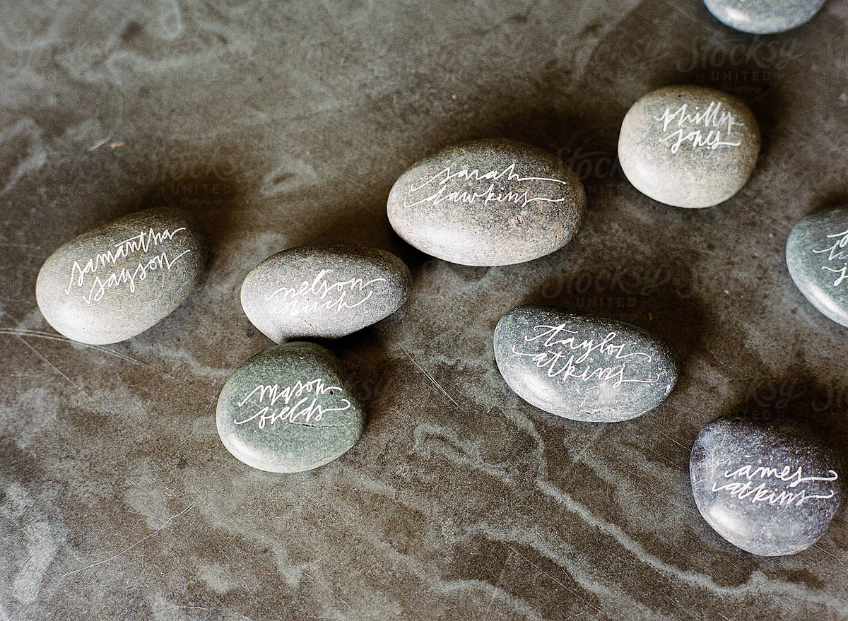 River rocks with fake names done in calligraphy