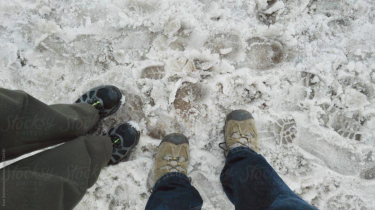 Hikers\' shoes on snowy trail, Norway