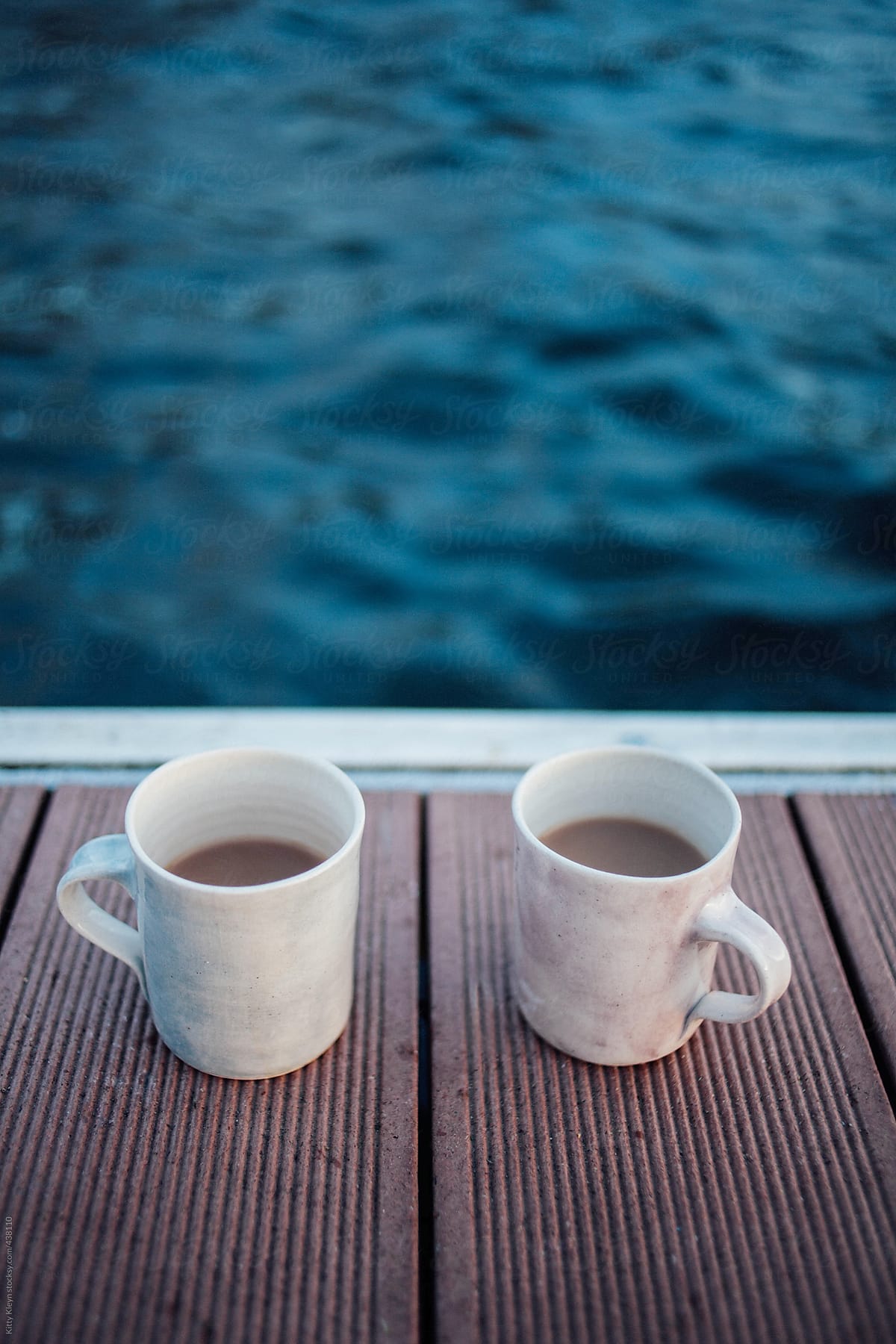 Two mugs on the lakeside