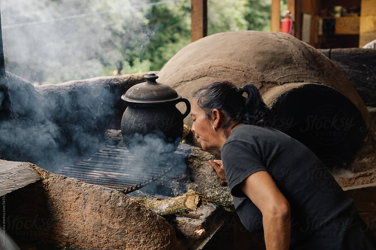 Older Mexican woman cooking.