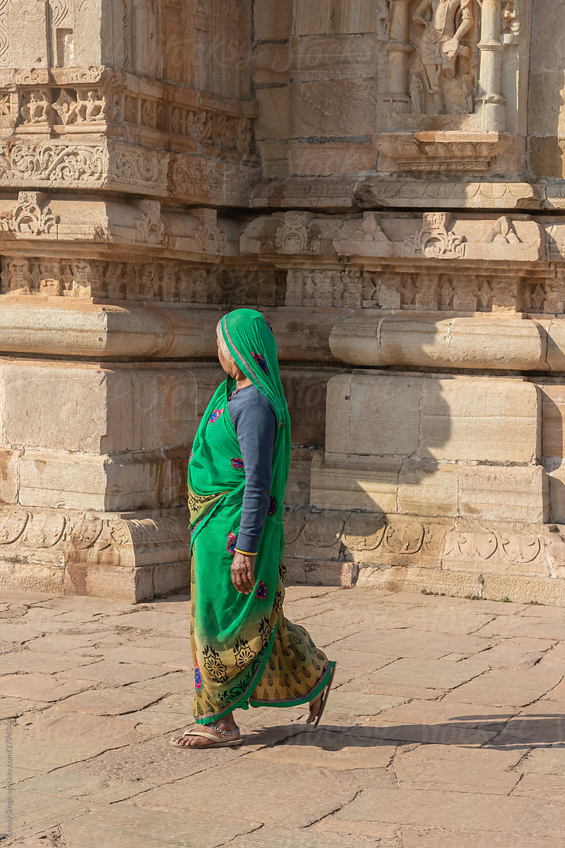 Traditional Woman in Sari Outside a Temple