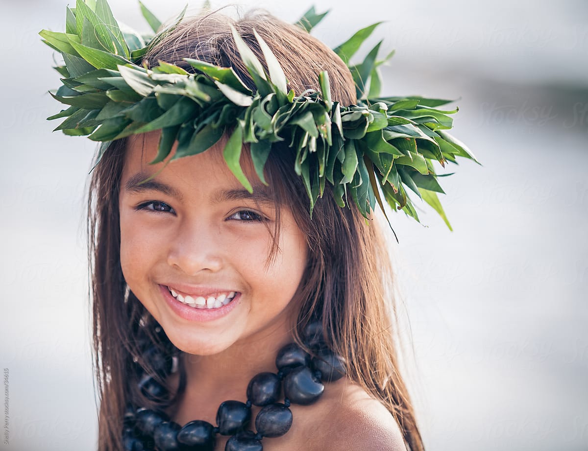 Portrait Of A Smiling Young Traditional Hawaiian Hula Dancer Girl By