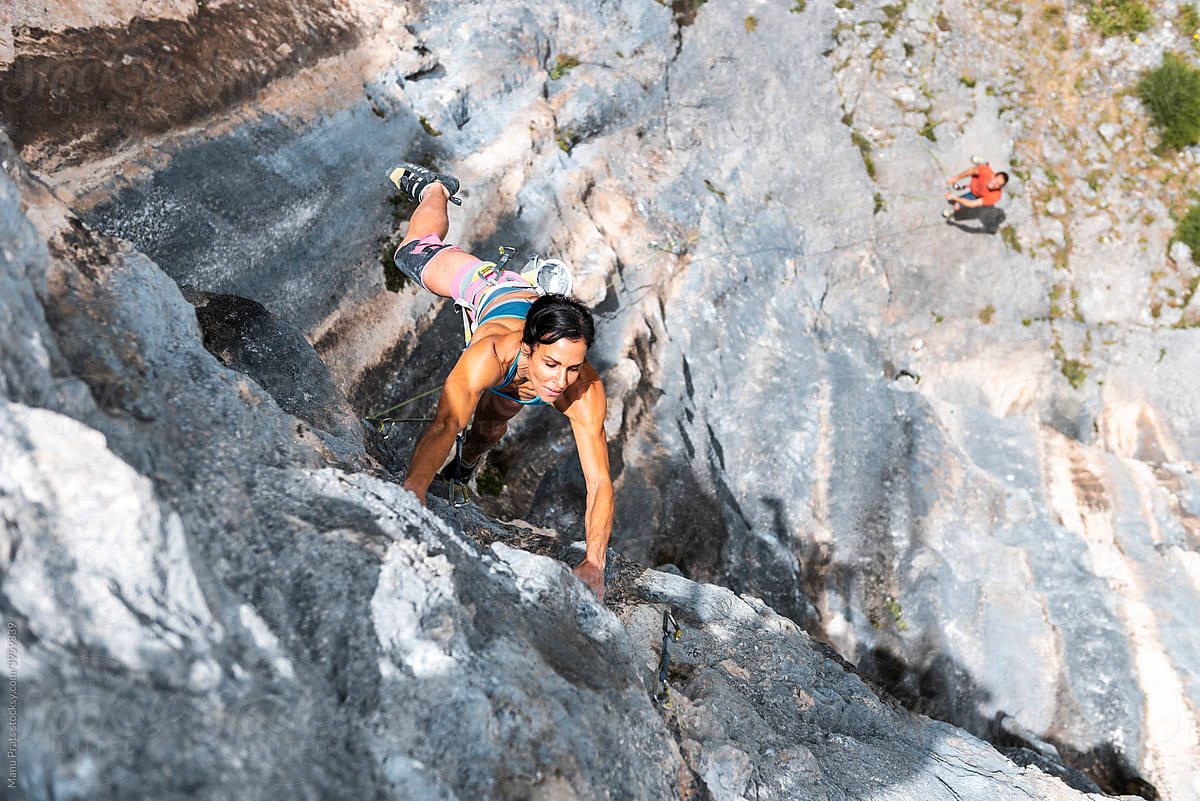 Mature woman rock climber