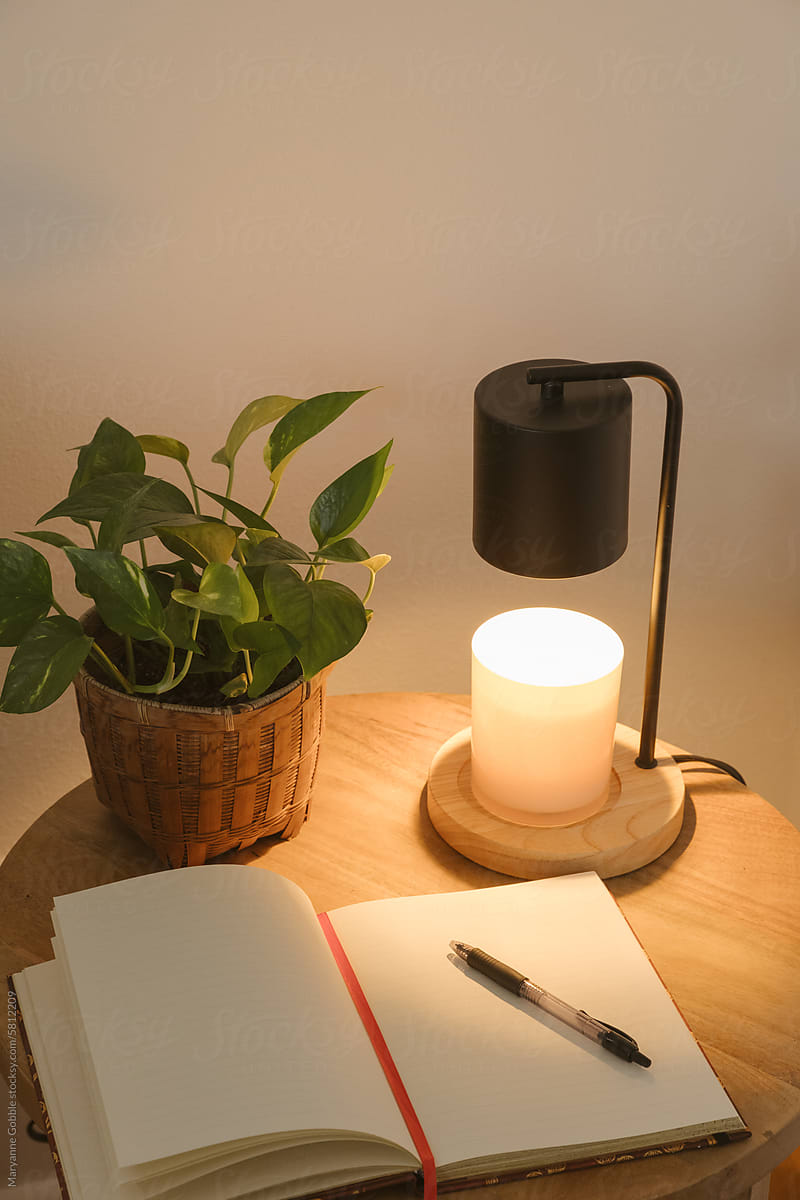 Candle Warmer and Writing Journal on Living Room Side Table
