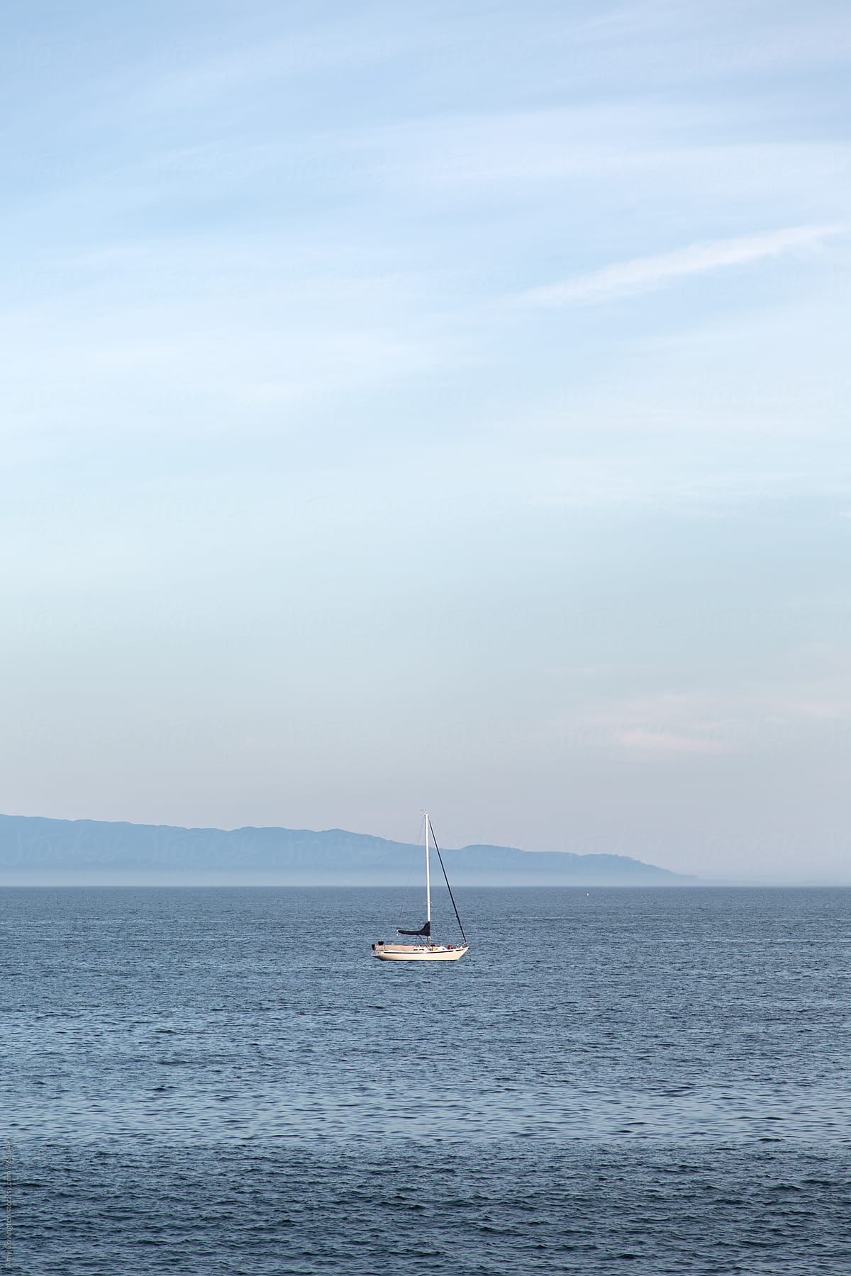 Sail boat floating in the ocean