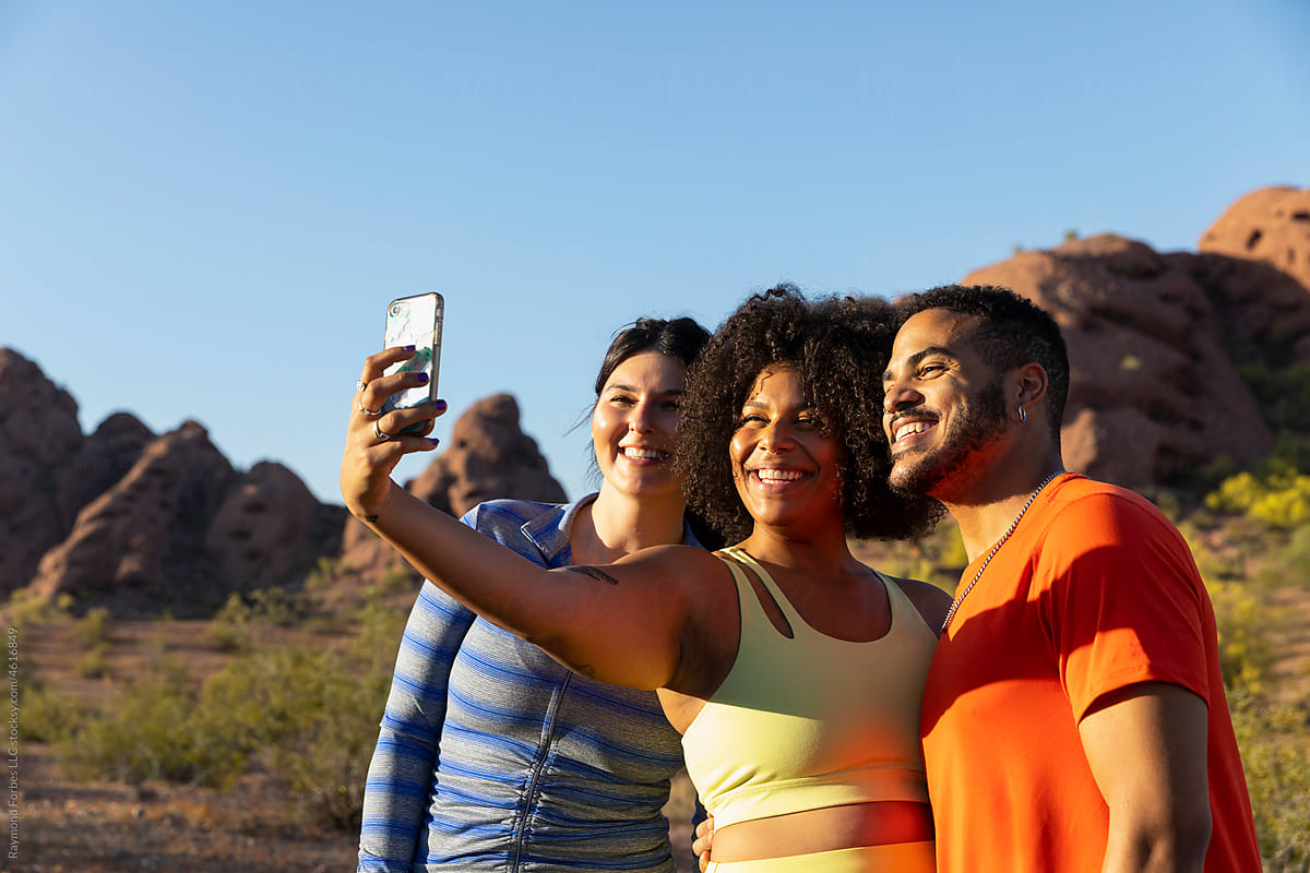Gang of Friends Hiking together in Arizona taking mobile phone selfie