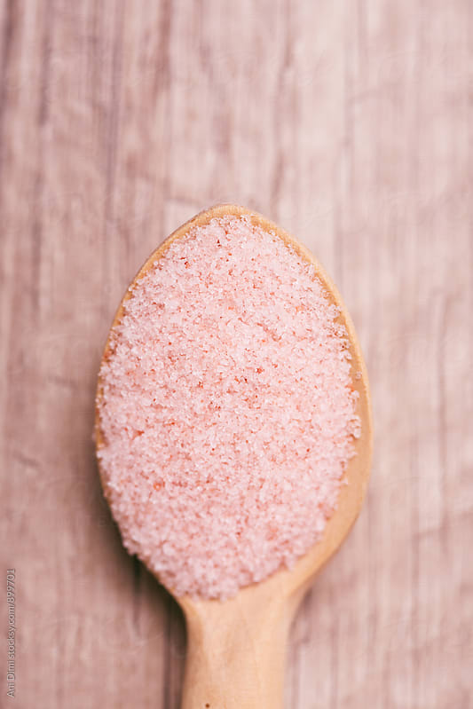 Himalayan pink salt in a wooden spoon