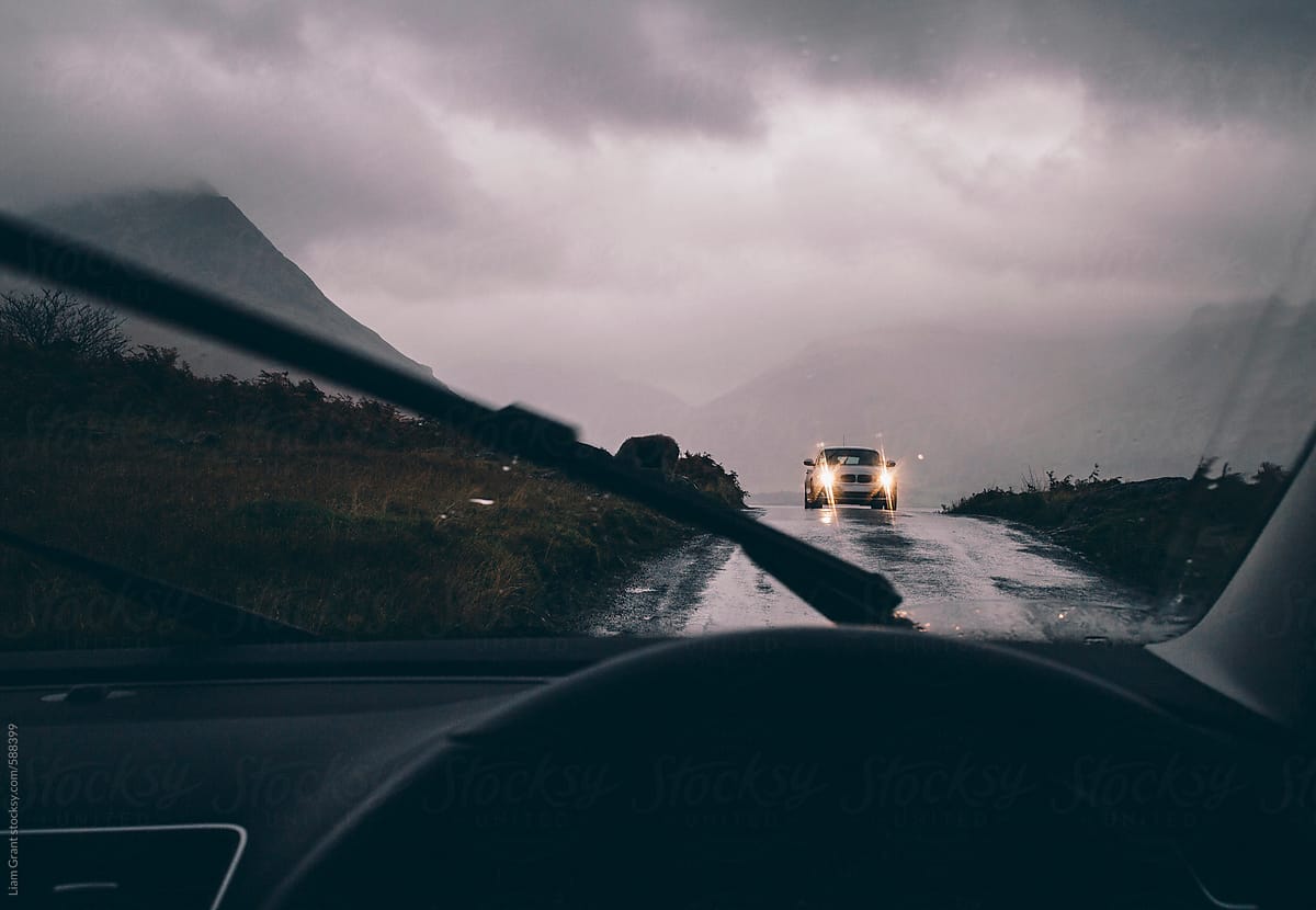 View whilst driving along a remote mountain road in heavy rain.