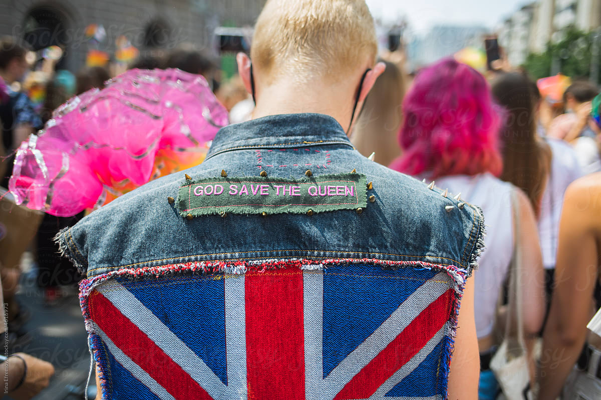 Back of a man in a god save the queen vest