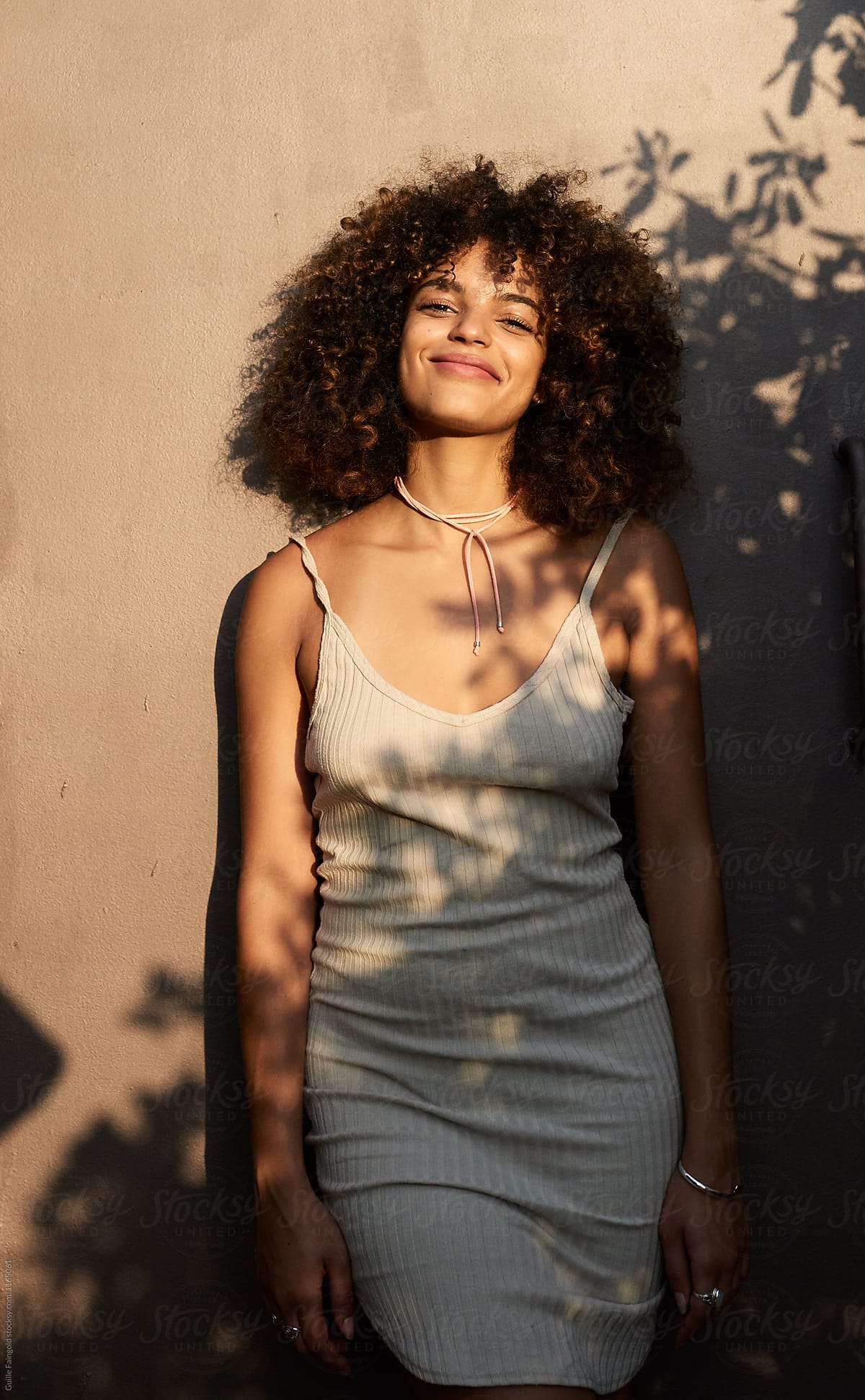 Confident Curly Hair Woman Smiling By Stocksy Contributor Guille Faingold Stocksy 
