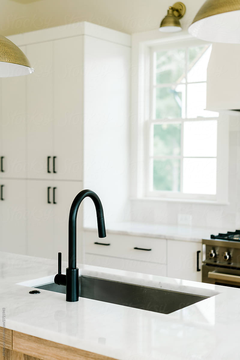 Black faucet and sink