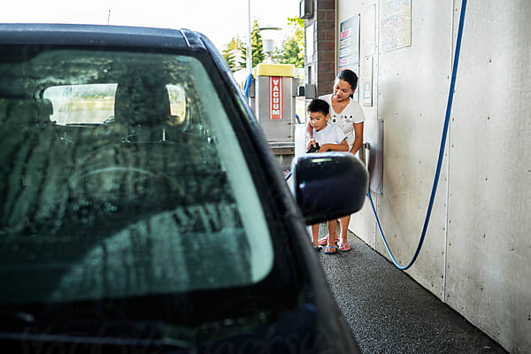 Asian Kid Washing A Car At A Car Wash by Stocksy Contributor Take A Pix  Media - Stocksy