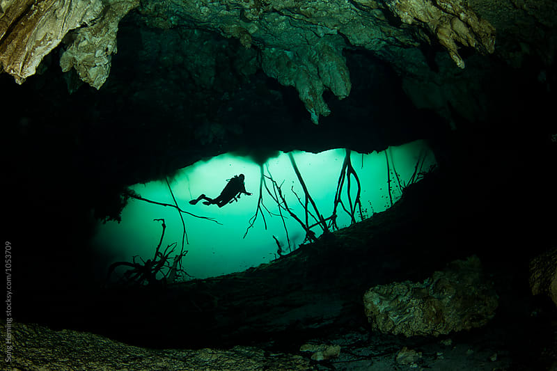 A scuba diver swimming in Mexico\'s  Cenote Car Wash