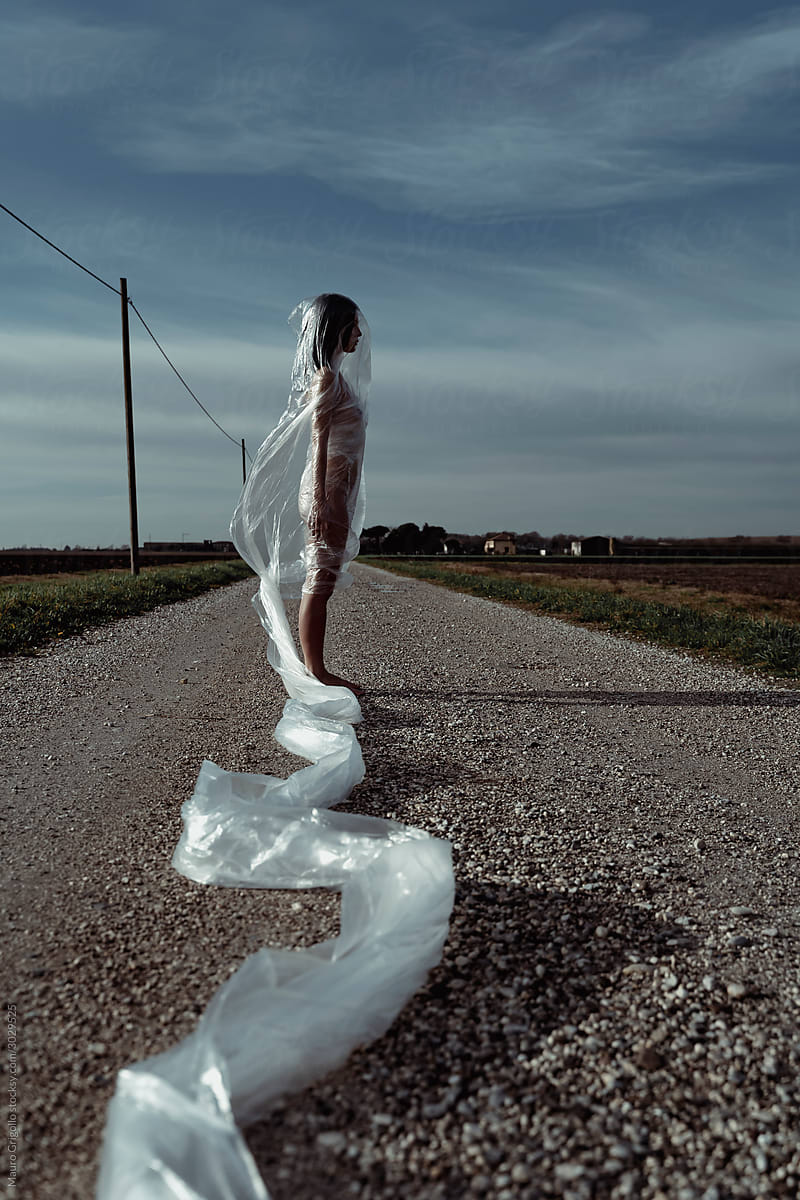 Woman outdoor covered with plastic film