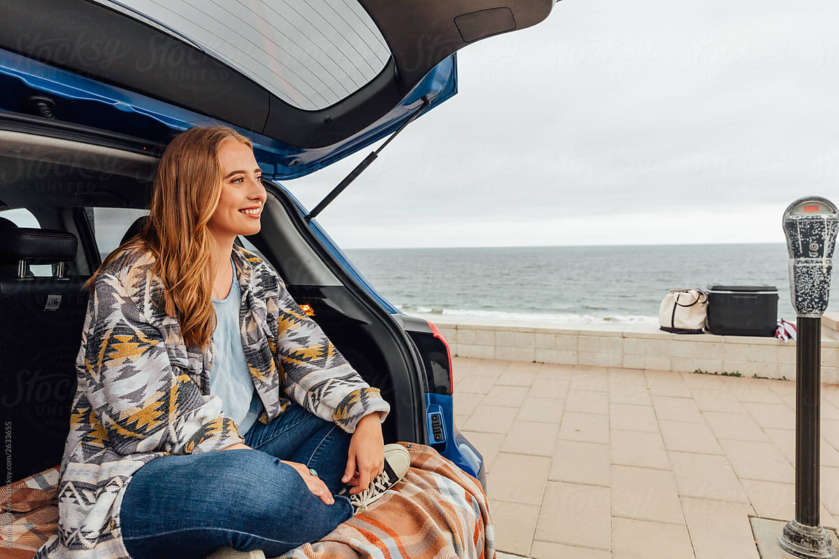 Young Woman Sits In Car By The Ocean By Stocksy Contributor Jayme Burrows Stocksy 