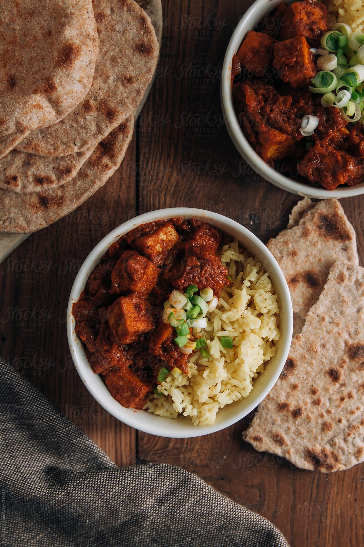 Spicy curry tofu with rice and garlic chapati
