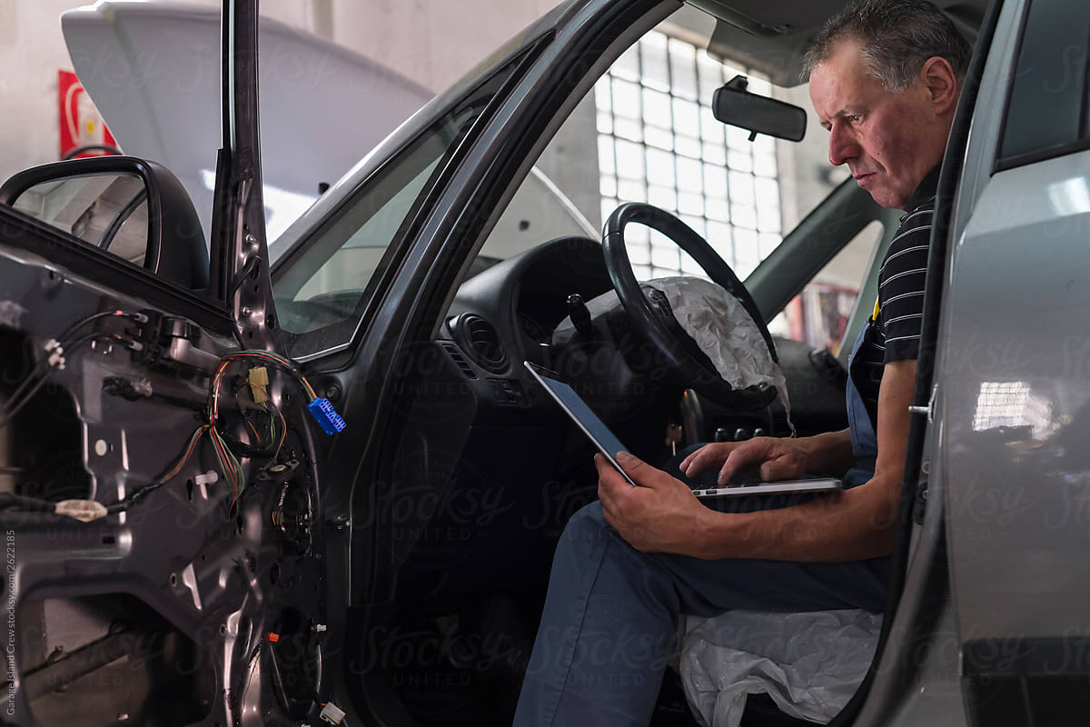 Mechanic at work in a repair car shop