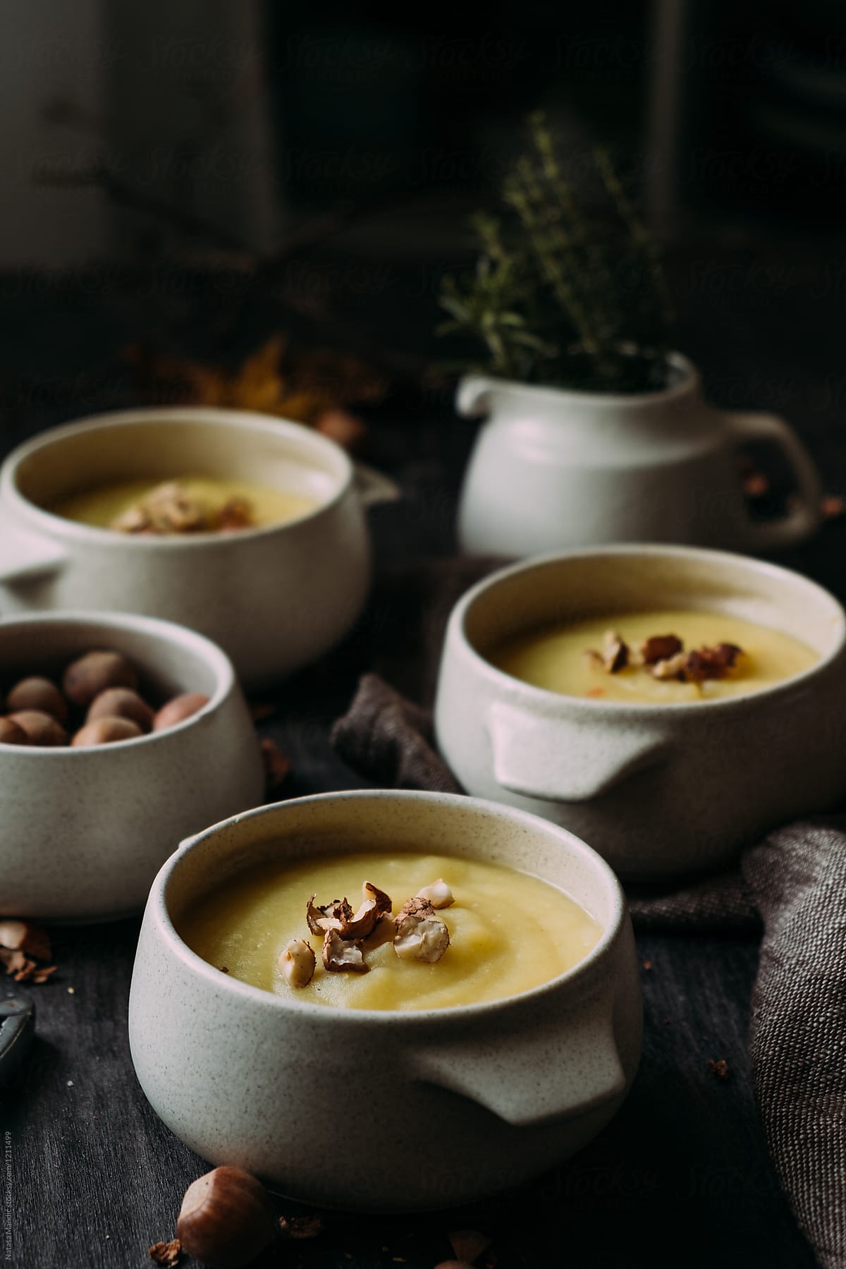 Homemade delicious creamy soup topped with hazelnuts