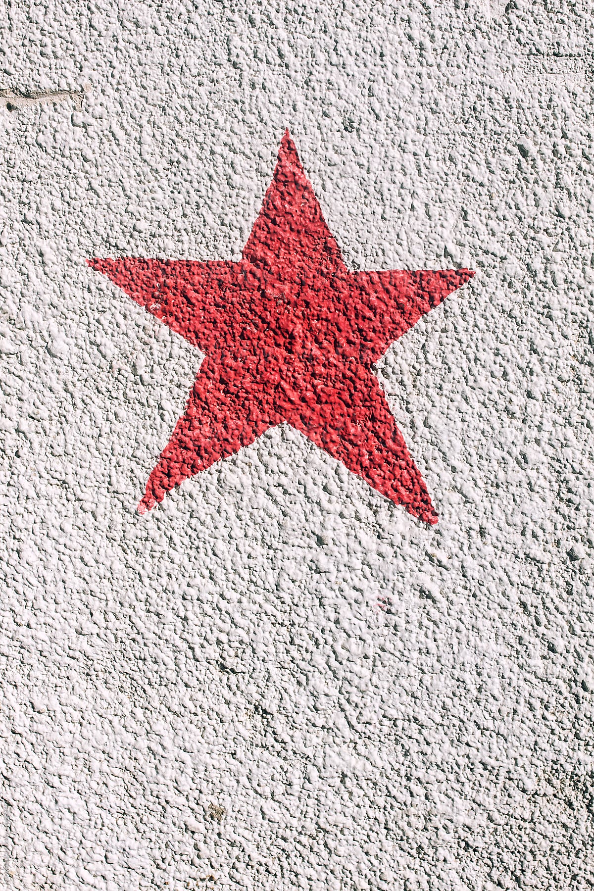 red star on a white wall, a symbol