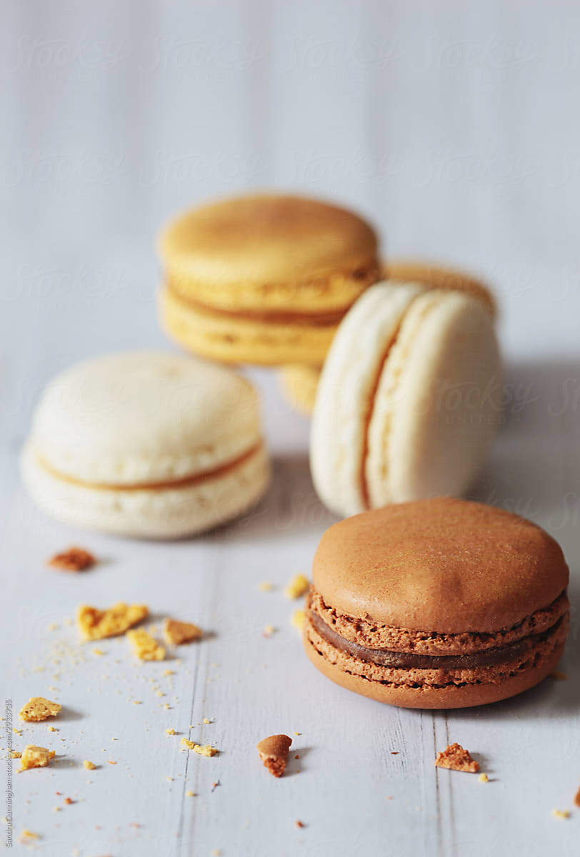 Chocolate, toffee french macarons on table
