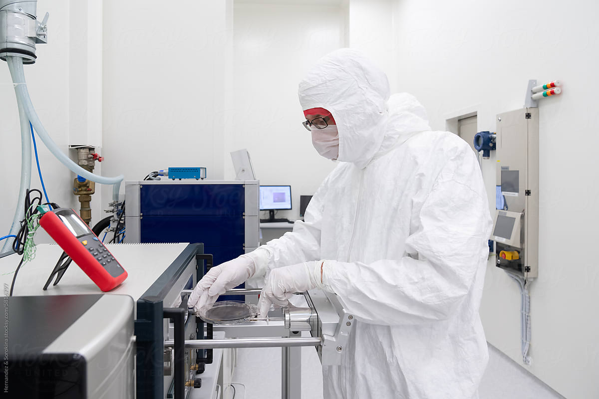 Researcher Working With Equipment In Semiconductor Laboratory