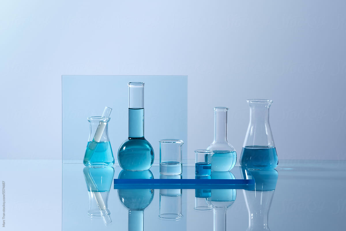 Laboratory glass equipment with blue water ingredients on