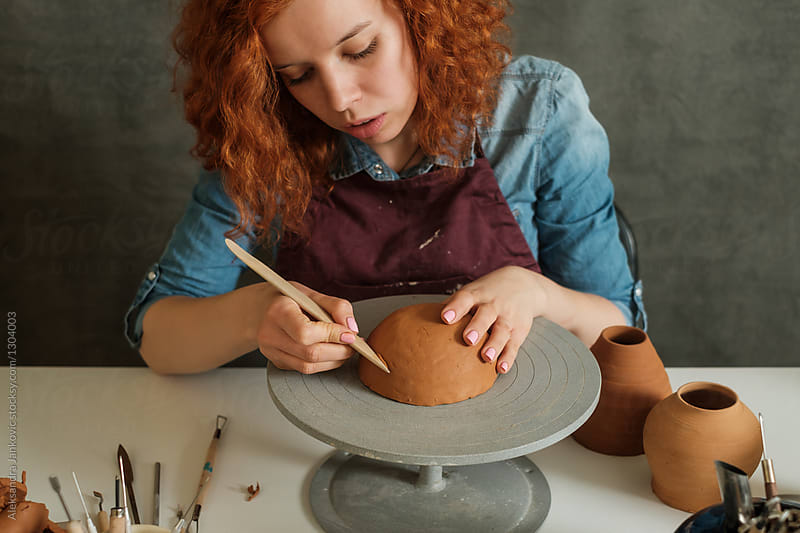 Young Woman Working At The Pottery Workshop
