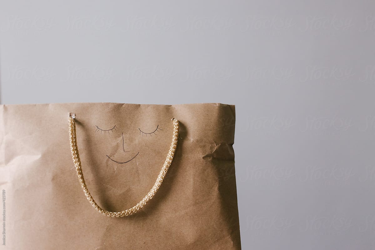 shopping bag with a smily face on it