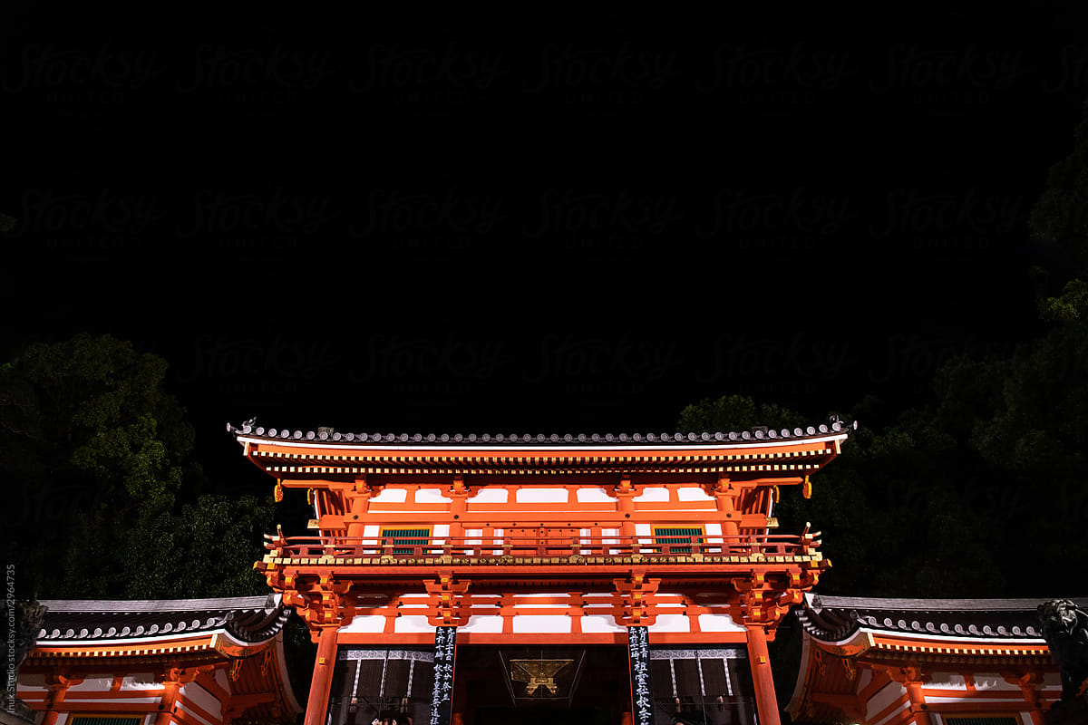Illuminated Shinto shrine at night