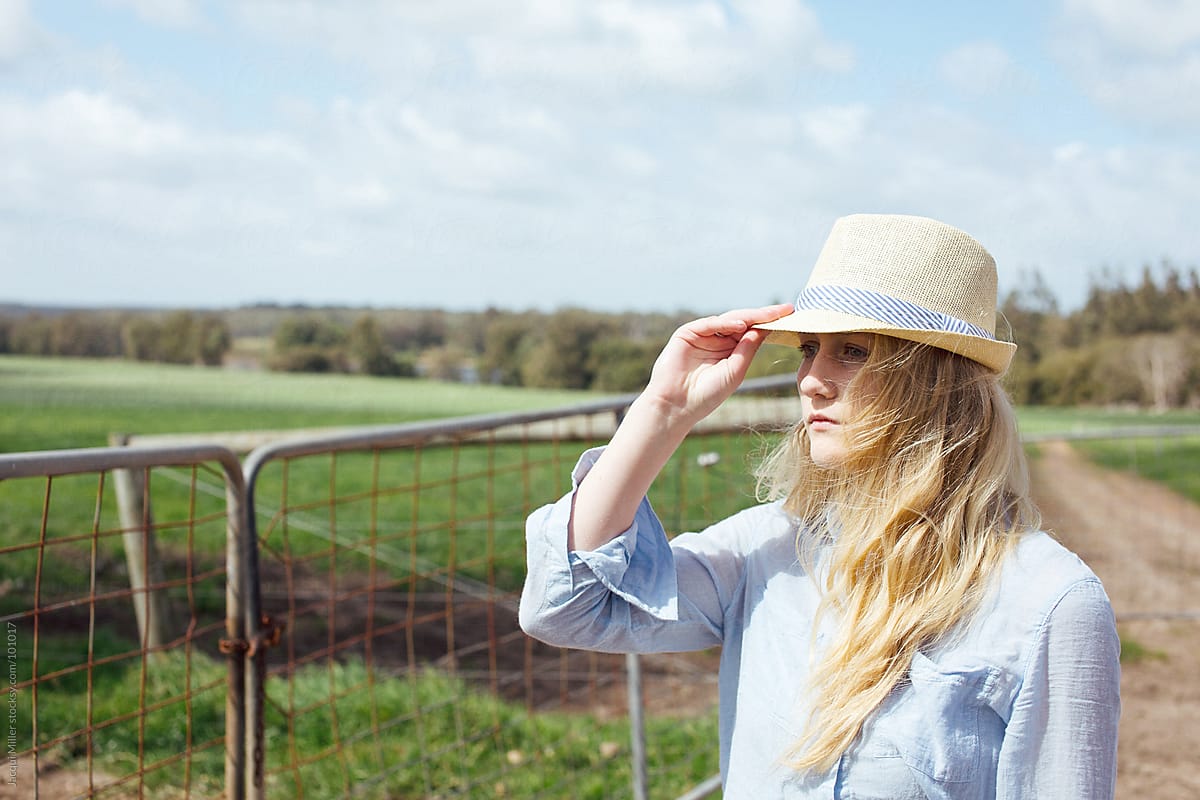 Young blonde-haired woman on farm