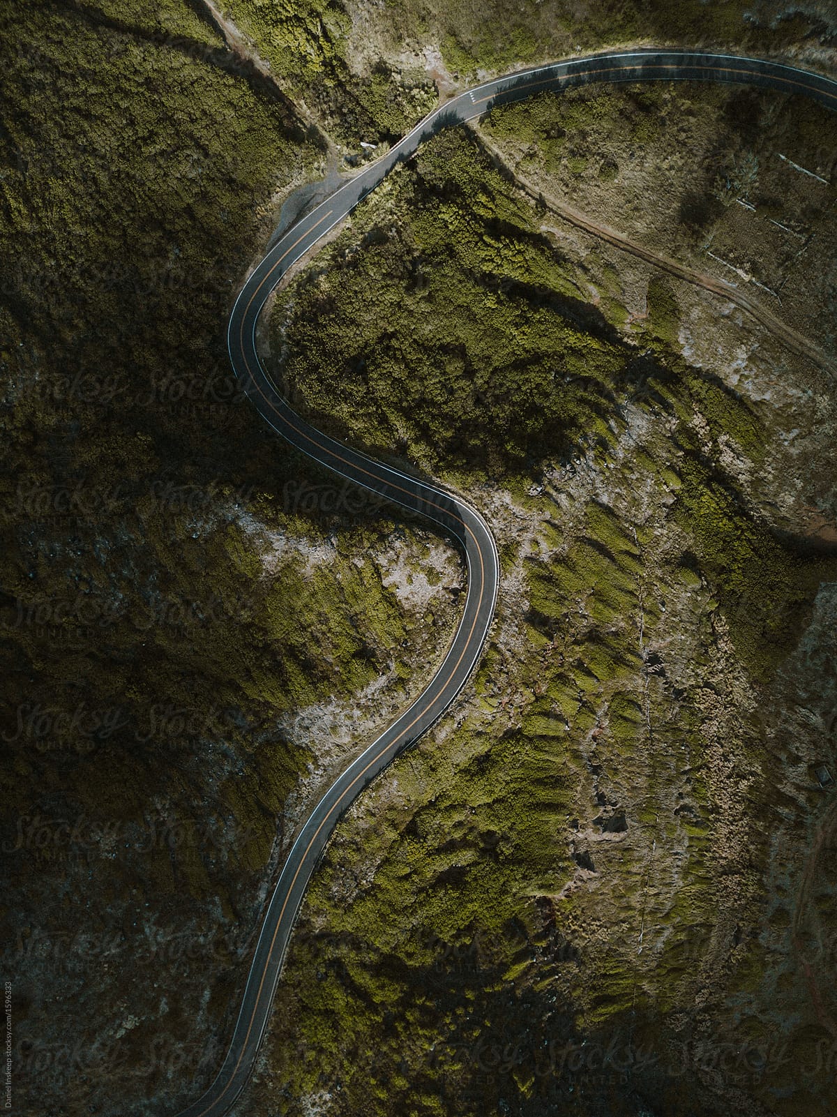 Aerial Shot Of A Curvy Road Through The Mountains By Stocksy