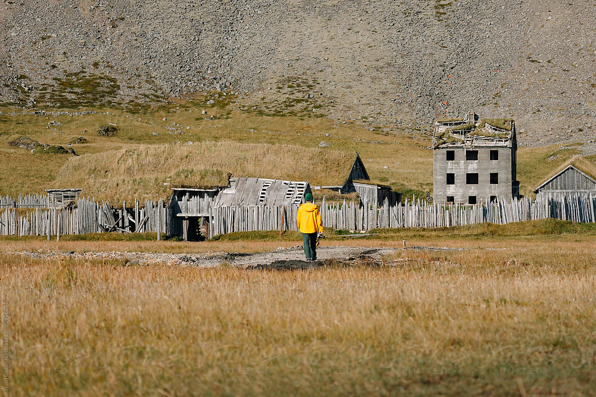 Unrecognizable Man exploring Viking Village Prop for movie, Iceland.