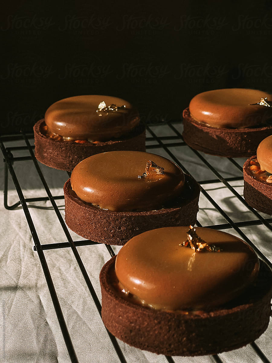 Chocolate tartlets with mousse on a stand