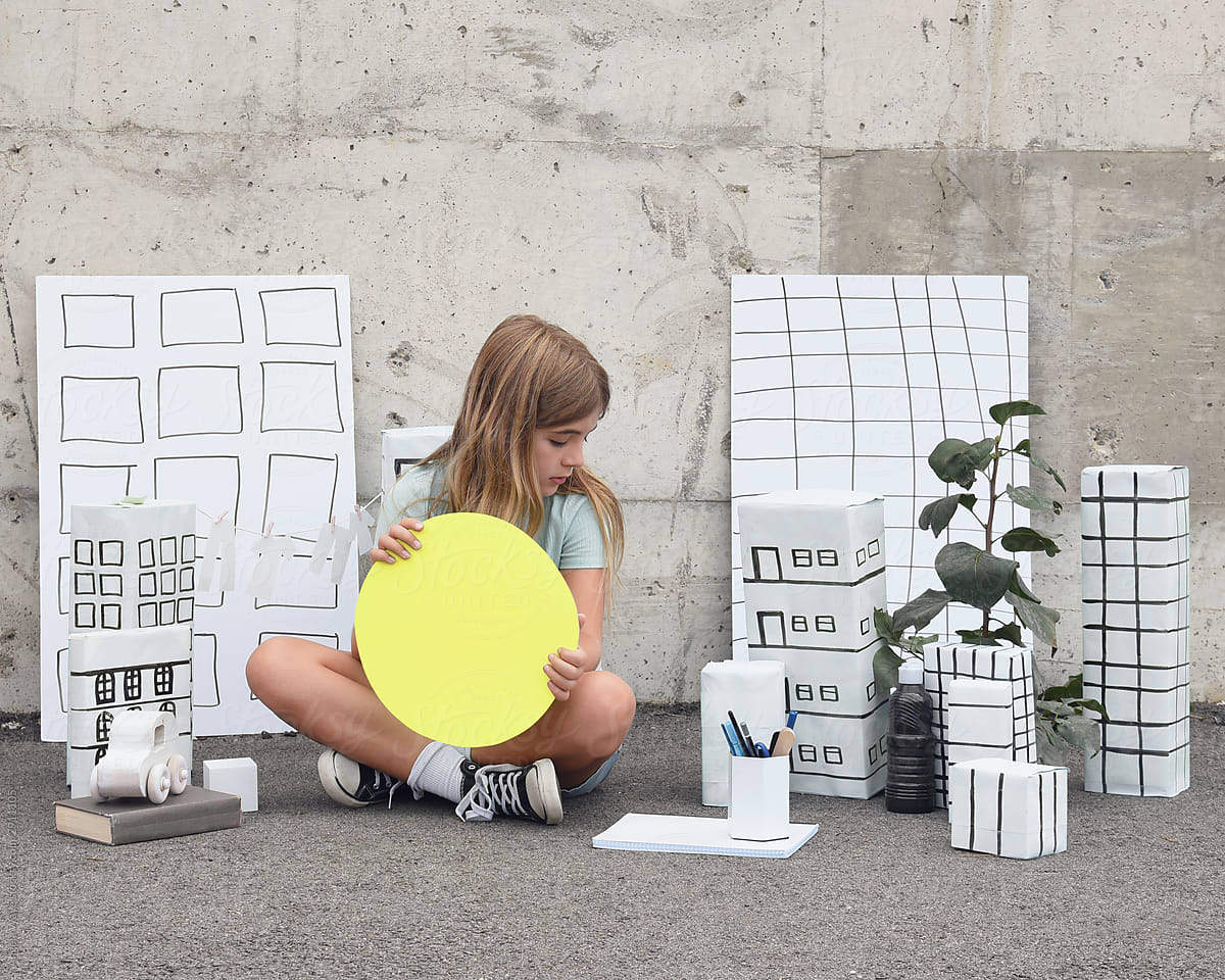 Creative Child Making Solar Sun Paper City